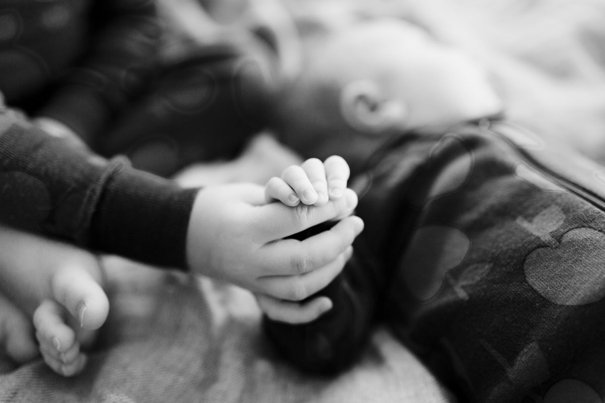 Siblings holding hands yoga